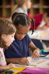 Lower School students with notepads