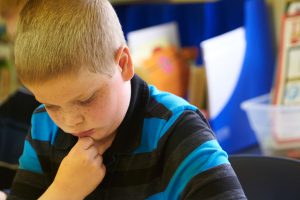 Lower School boy thinking