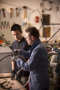 teacher and stydent in Bicycle Mechanics Club