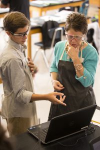 student and teacher in biology lab
