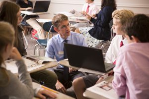 Middle School history teacher with student