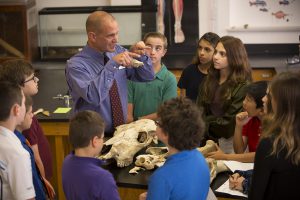 Science teacher with bones