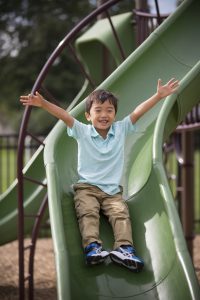 Lower School boy on slide