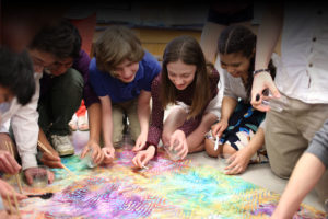 kids working on project on floor
