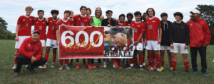 soccer team with 600 banner