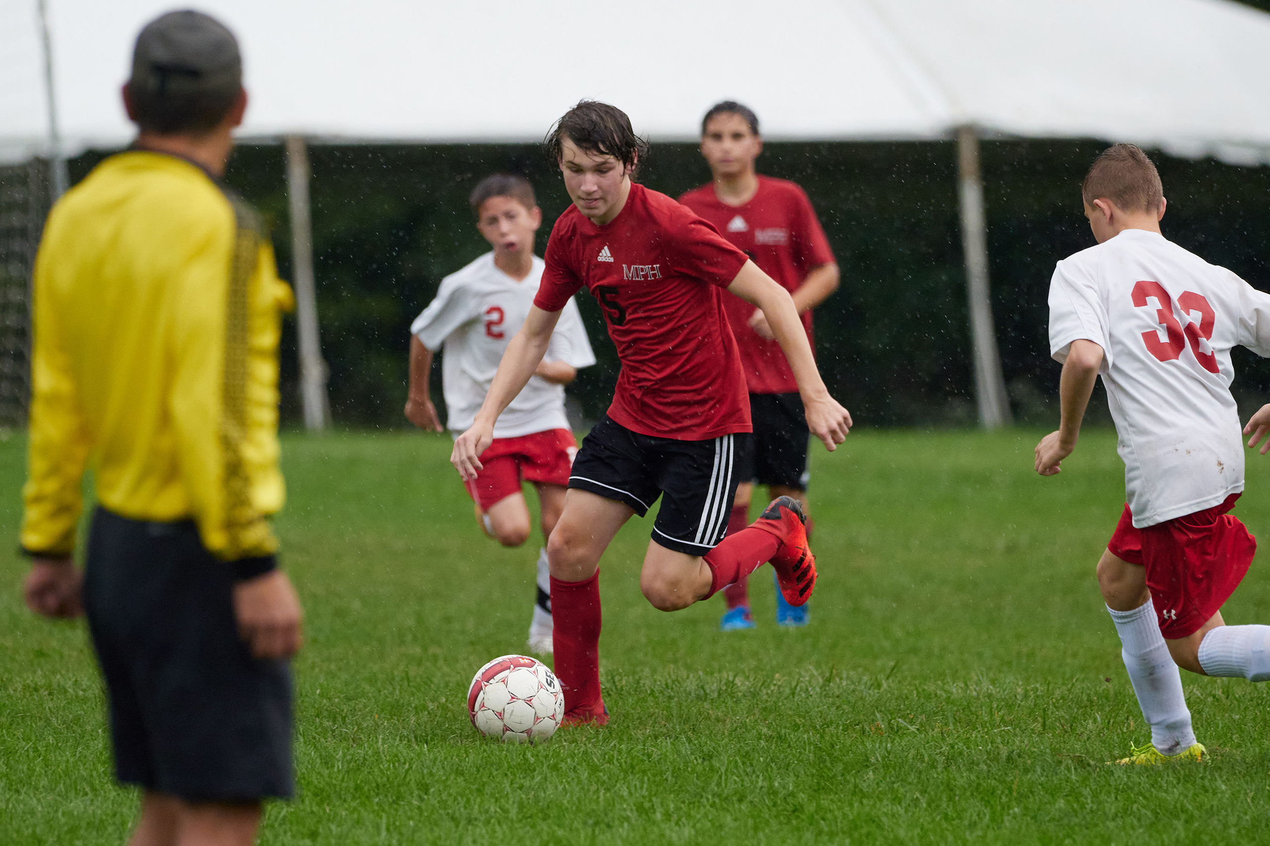 students playing soccer in a game